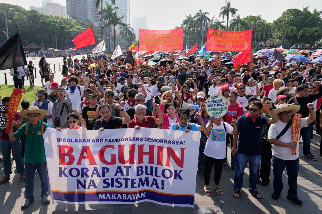 Protesters shout slogans during anti-corruption protest in Manila, Philippines on Sunday Nov. 30, 2025.