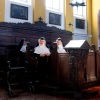 Sisters Rita (R), 81, Regina (L), 86, and Bernadette (C), 88, pray with over a dozen of supporters and former students, at the convent chapel of the Goldenstein castle, in the municipality of Elsbethen, south of Salzburg city, Austria on Sept. 20, 2025. Supporters of three rebel nuns in their 80s who had graced international headlines after fleeing their care home to occupy their former convent in Austria's Salzburg province flocked to the nunnery Saturday in a show of solidarity.