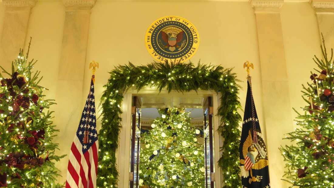 Christmas trees line the Grand Foyer during a tour of the Christmas decorations inside the White House in Washington, D.C., on Monday.