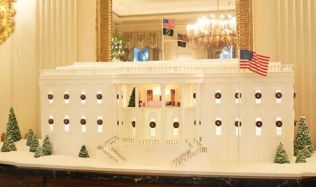A gingerbread White house is displayed in the State Dining Room Monday, Dec. 1, 2025, during a tour of the Christmas decorations inside the White House in Washington, D.C.