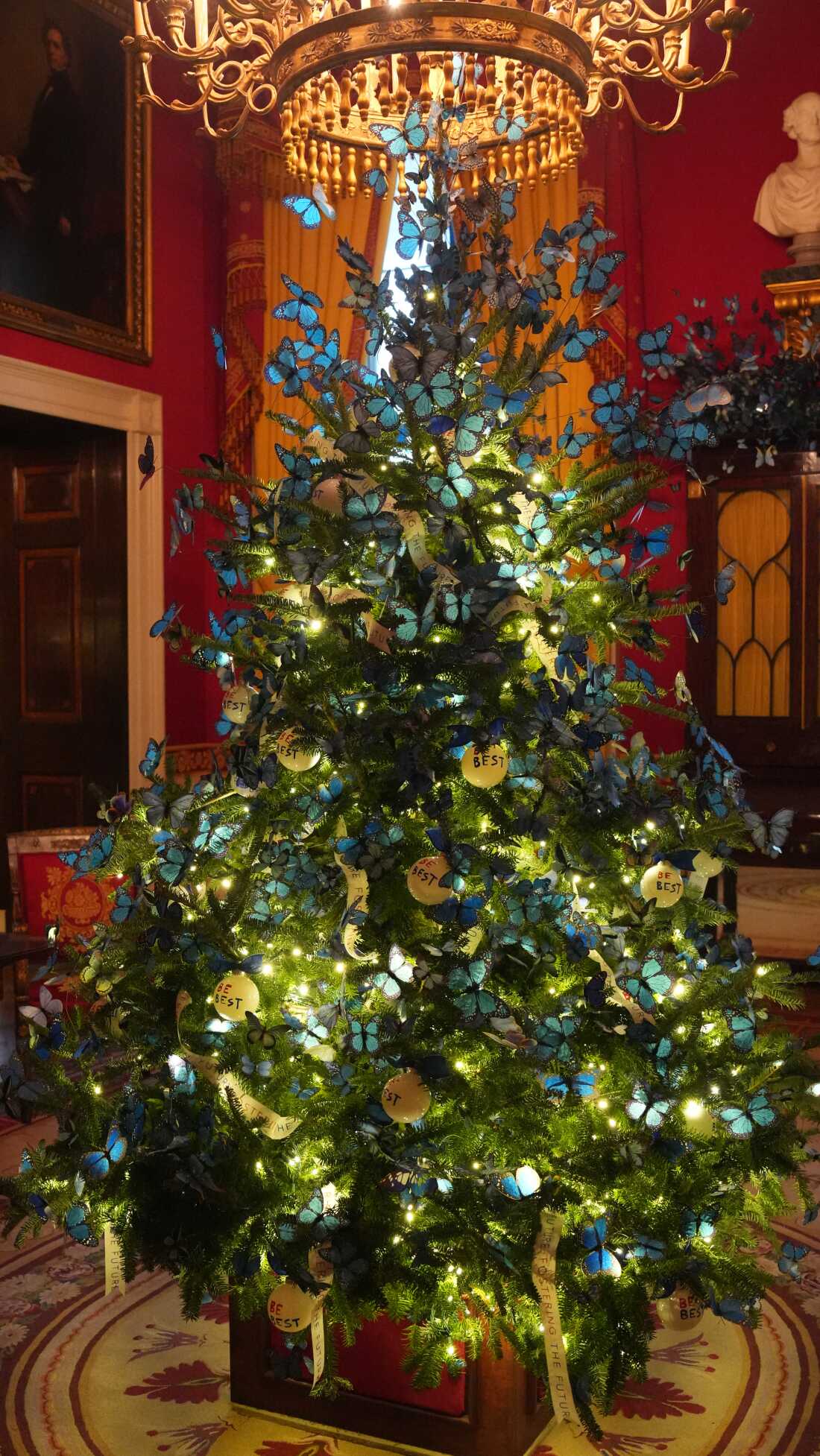 Butterflies spiral out of a tree in the Red Room Monday, Dec. 1, 2025, during a tour of the Christmas decorations inside the White House in Washington, D.C.