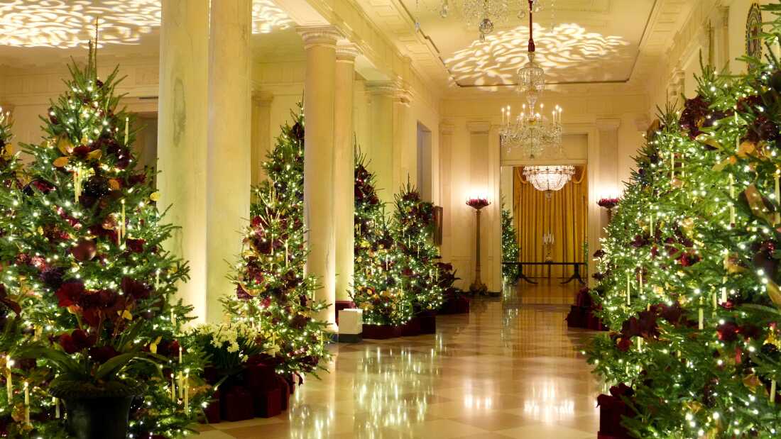 Trees line the Grand Foyer inside the White House.