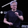 Nvidia CEO Jensen Huang delivers his keynote address on June 11, 2025, at the VivaTech fair in Paris. He's wearing a black T-shirt, dark pants and glasses while standing to give his address.