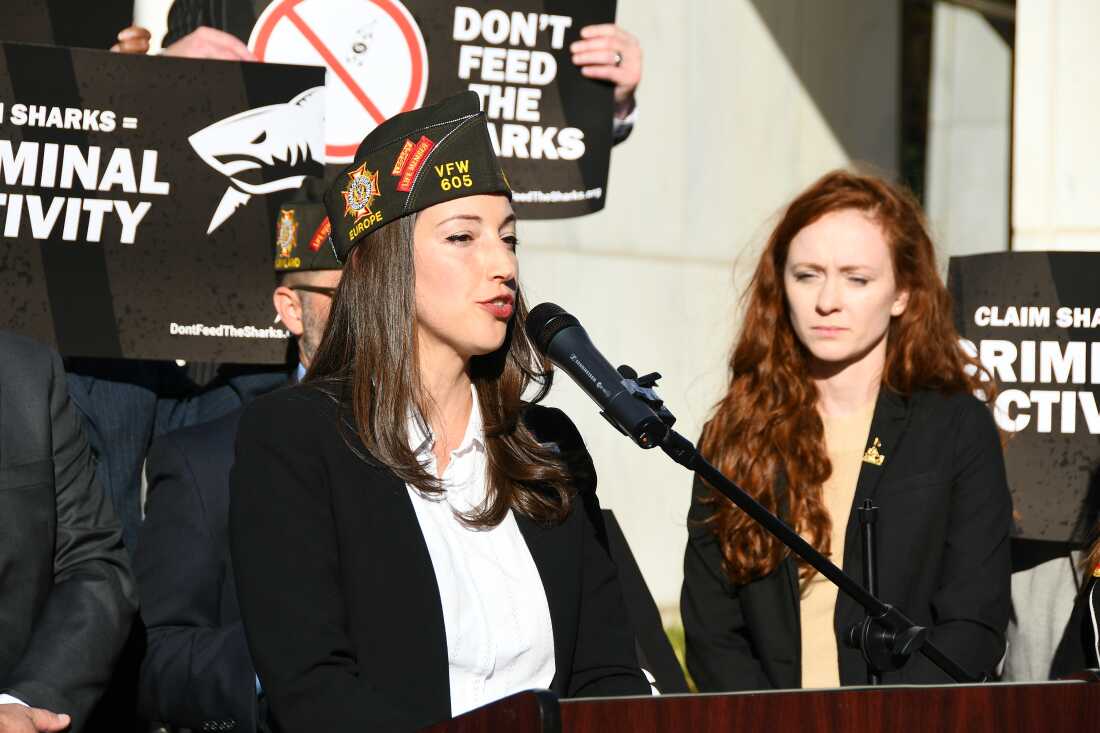Kristina Keenan, National Legislative Service Director at VFW, takes the podium at a “Don’t Feed the Sharks” press event on Nov. 14, 2023.