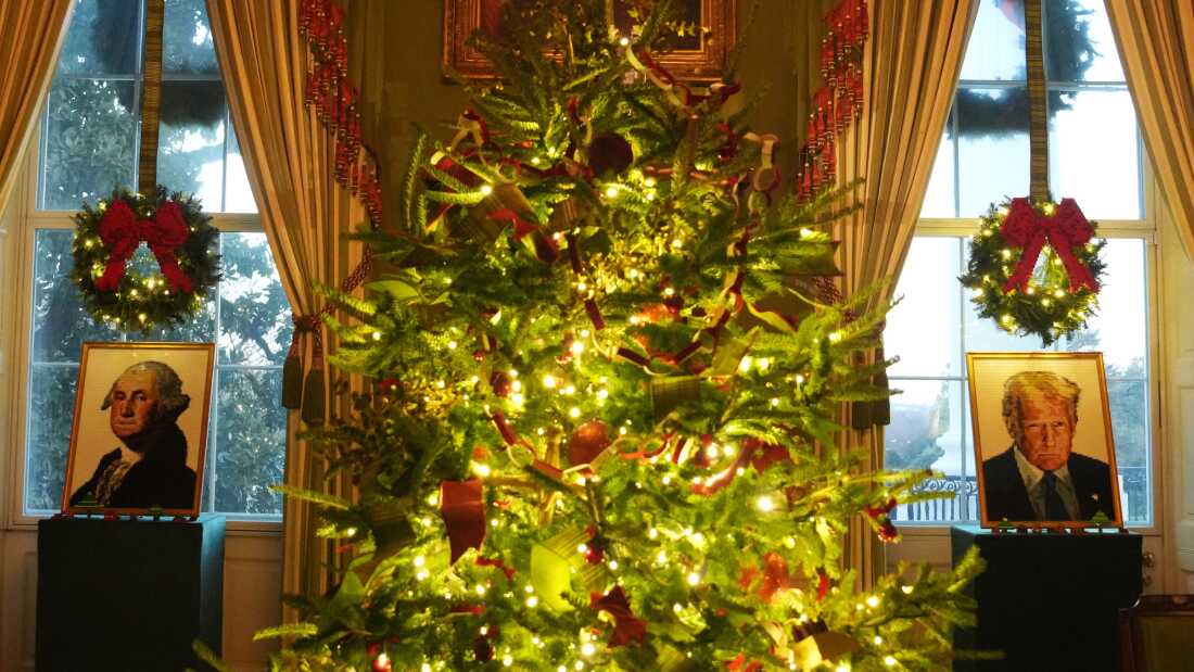 Lego portraits of George Washington and President Trump adorn the windows in the Green Room during a tour of the Christmas decorations inside the White House on Monday.