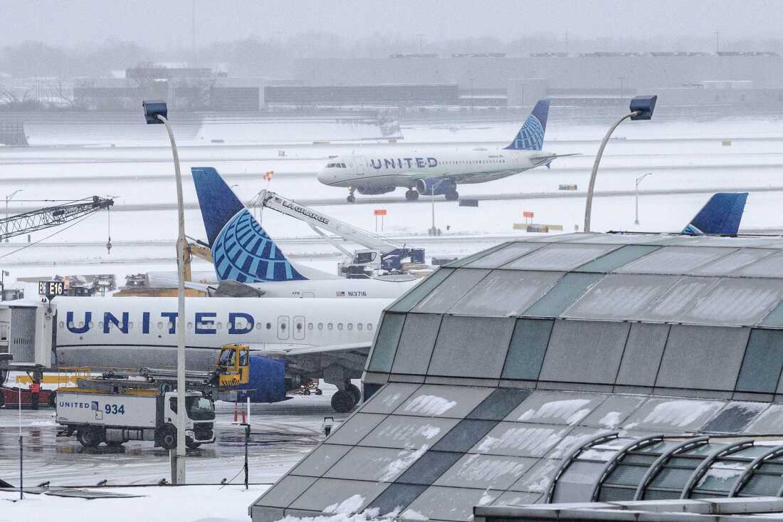 United Airlines planes are seen at O'Hare International Airport in Chicago on Sunday after a winter snowstorm hit the area.