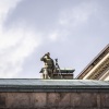 A sniper is seen on a roof as police secures the venue of a meeting of European Union leaders at Christiansborg Palace in Copenhagen, Denmark, on Wednesday.