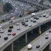 In an aerial view, cars travel along Interstate 80 in Berkeley, Calif., on January 16, 2024.