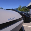 A selection of Kia EV6 electric sedans are displayed at a dealership in Manchester, N.H., in July. The EV6 is eligible for a federal tax credit worth up to $7,500 for buyers under a certain income cap. And like all electric vehicles, it's eligible for a $7,500 tax credit on a lease. But the tax credits are expiring on Sept. 30th.