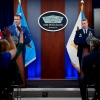 U.S. Defense Secretary Pete Hegseth (L), accompanied by Chairman of the Joint Chiefs of Staff Air Force Gen. Dan Caine (R), speaks during a news conference at the Pentagon in June in Arlington, Va.
