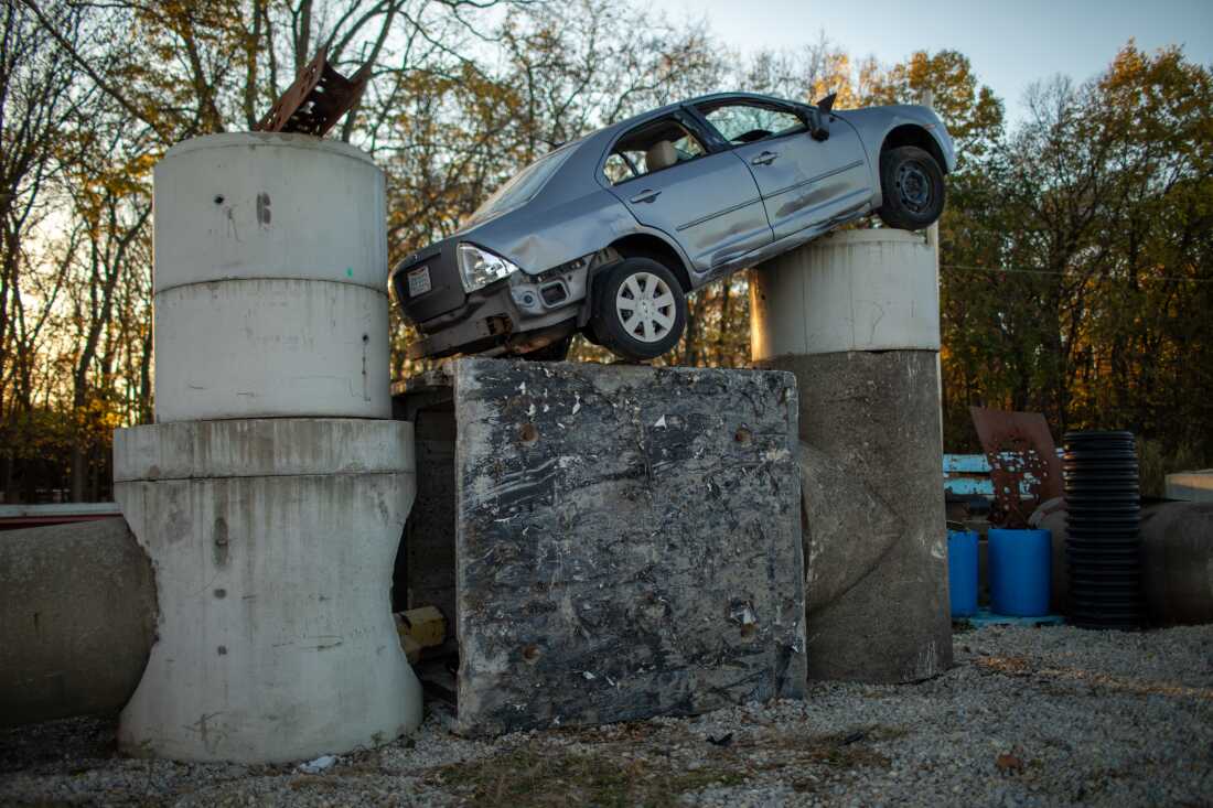 A damaged car sits on top of concrete blocks at the training site for Ohio Task Force 1.