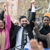 Democratic New York City mayoral candidate Zohran Mamdani (C) raises his hands during a campaign event with New York City elected officials on November 1, 2025 in the Queens borough of New York City. Mamdani remains the front runner against Independent candidate, former New York Gov. Andrew Cuomo and Republican candidate Curtis Sliwa.