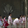 Chinese students wait outside the U.S. Embassy for their visa application interviews, in Beijing on May 2, 2012.