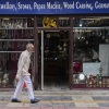 A Kashmiri man walks past a shop displaying stone jewelry and Kashmiri handicrafts in Srinagar, in Indian-controlled Kashmir.