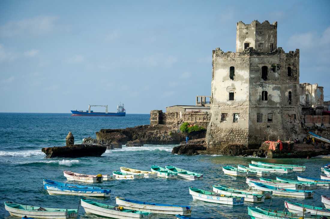 Somali fishing boats are seen in the old port and traditional lighthouse at Lido beach on Nov. 11, 2022 in Mogadishu, Somalia.
