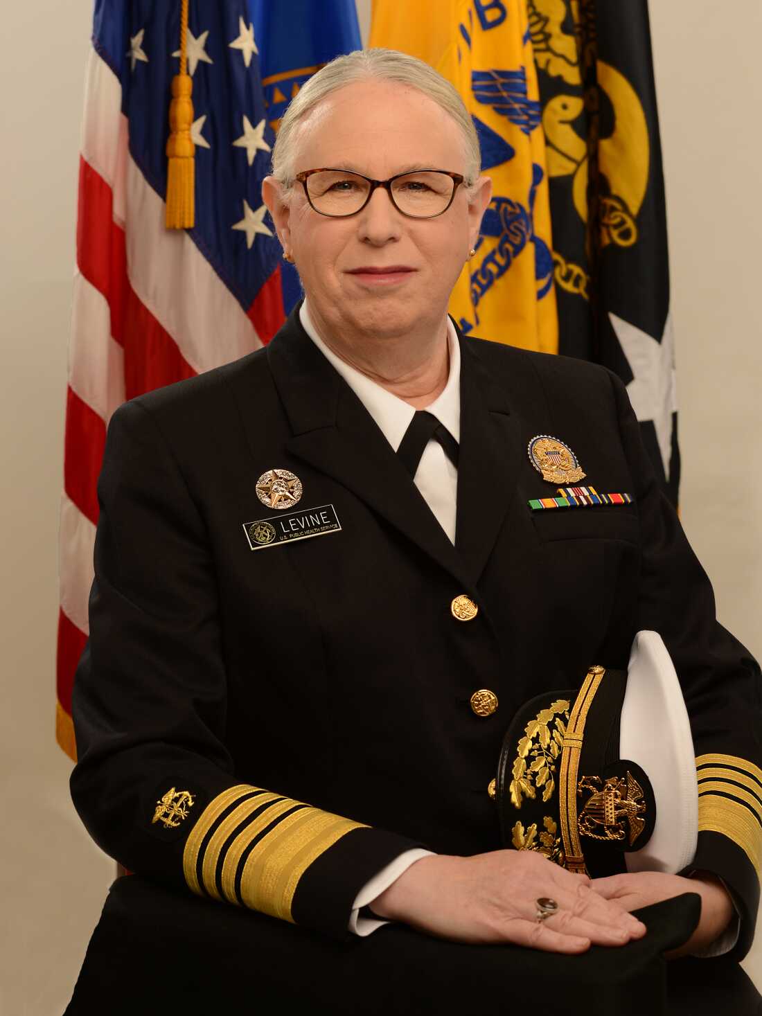 Adm. Rachel Levine's official portrait is a vertical photo of her, wearing her uniform.