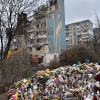 Outside a destroyed apartment building in the western Ukrainian city of Ternopil, local residents have left flowers, candles and stuffed toys to commemorate the dozens, including several children, killed in an overnight Russian attack