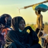 A displaced woman rests in Tawila, in the country's war-torn western Darfur region, on Tuesday, after fleeing el-Fasher following the city's fall to the Rapid Support Forces (RSF).