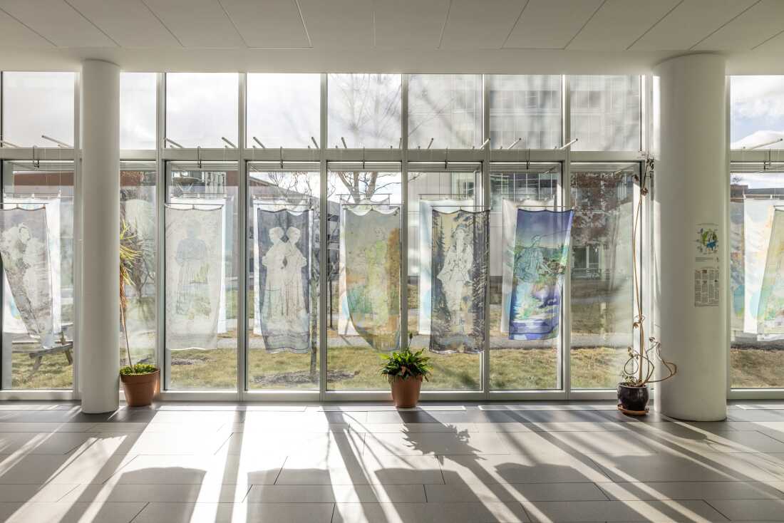 An art installation by artist Adrienne Ottenberg Portraits with Maps: Independence and Betrayal in Maine in the lobby area of the library.