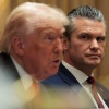Secretary of Defense Pete Hegseth looks on as President Trump speaks during a Cabinet meeting at the White House on Wednesday.