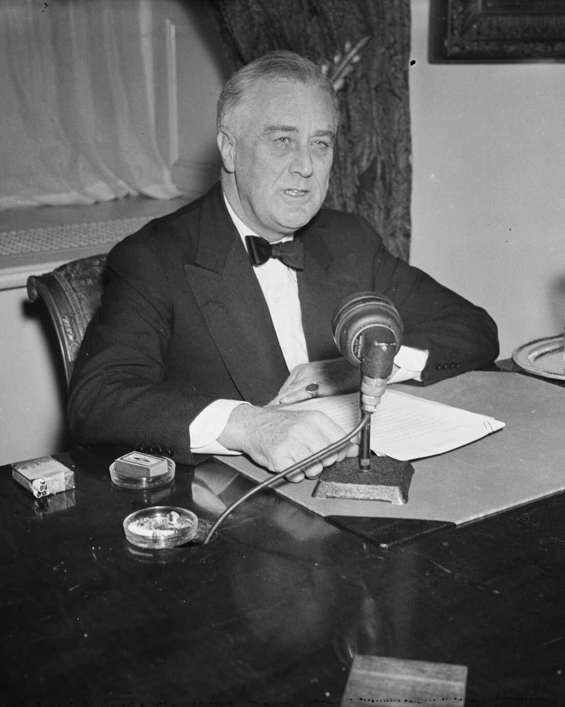 Former president Franklin D. Roosevelt during a radio broadcast circa 1933–40.