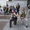 FBI personnel take a knee with demonstrators that were marching on Pennsylvania Avenue in Washington, D.C., on June 4, 2020, during a protest over the death of George Floyd.