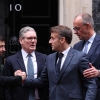 From left: Ukrainian President Volodymyr Zelenskyy, British Prime Minister Keir Starmer, French President Emmanuel Macron and German Chancellor Friedrich Merz chat on the 10 Downing Street doorstep after a meeting in central London on Monday. 8, 2025. (Photo by Adrian DENNIS / POOL / AFP via Getty Images)