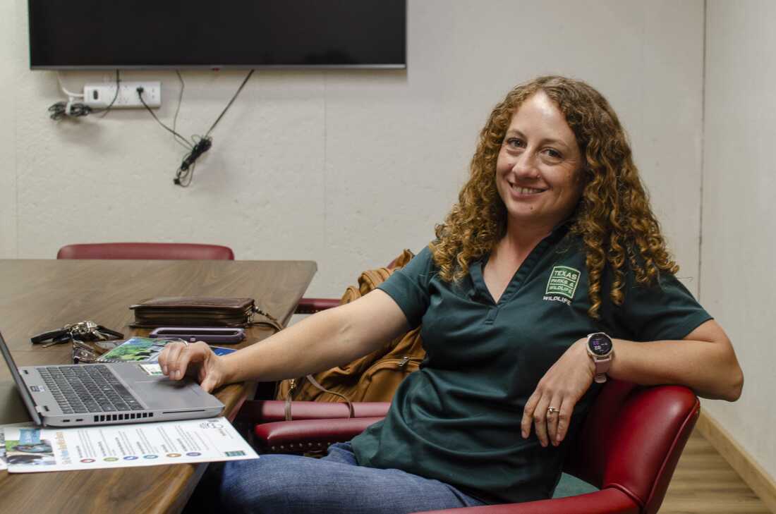 Krysta Demere sits in the offices for Texas Parks and Wildlife Department in Alpine. Part of her job as a wildlife biologist is getting people ready to live with Black bears and educate them in hopes of reducing bear-human conflict.