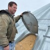 Soybean farmers like Kevin Deinert have grain bins full of beans
