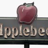 A sign marks the location of an Applebee's restaurant in Chicago, Illinois July 28, 2003.
