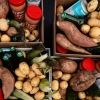 An overhead and close-up photo of four cardboard boxes, each filled with fresh and shelf-stable food, pushed together up in a square. The boxes contain sweet potatoes, white potatoes, jars of peanut butter, fresh corn, cans of mushroom soup and green glass bottles.