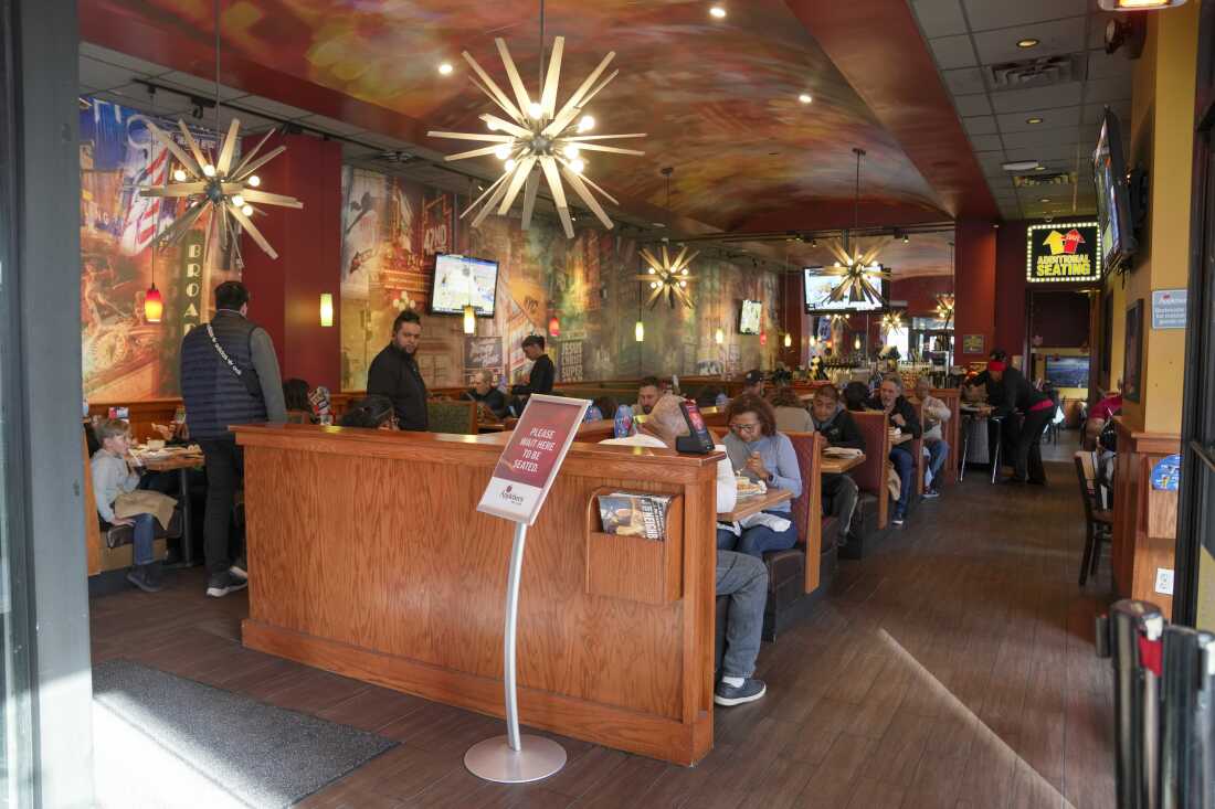 People dine at the Applebee's in Times Square.