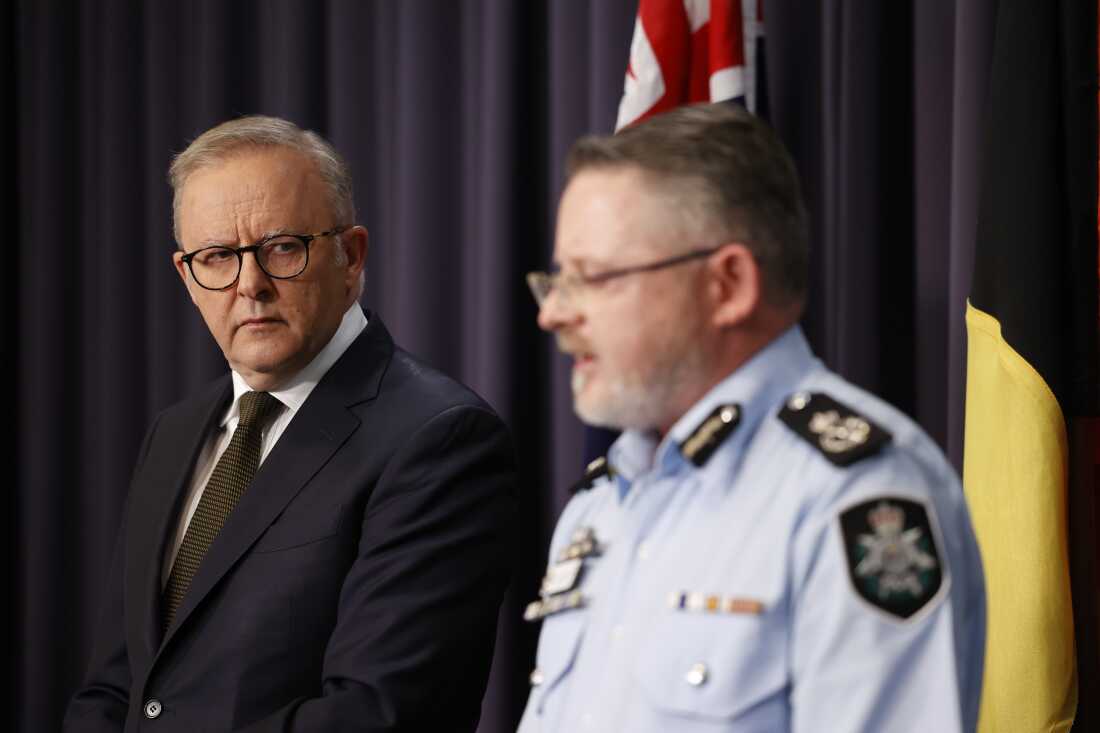 Australia's prime minister, Anthony Albanese, (left) at Parliament House with AFP Acting Deputy Commissioner for National Security Nigel Ryan speak after the Bondi Beach shooting.
