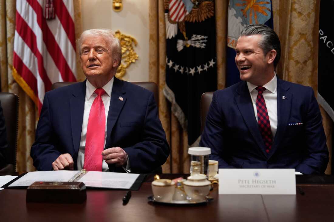 President Donald Trump and Defense Secretary Pete Hegseth, seen here in a cabinet meeting on December 2nd, have justified the military strikes on civilian vessels in international waters as part of the national security strategy against "narco-terrorists."