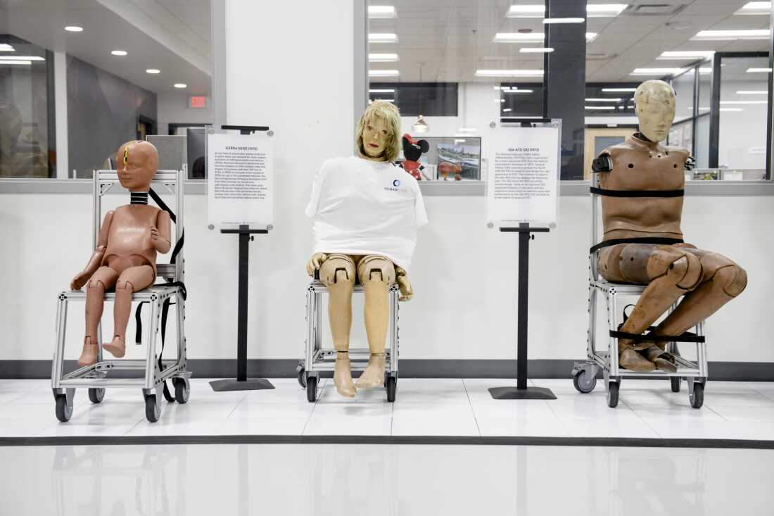 Crash test dummies from past decades sit in line for instructional purposes at a Humanetics production facility in Farmington Hills, Mich.