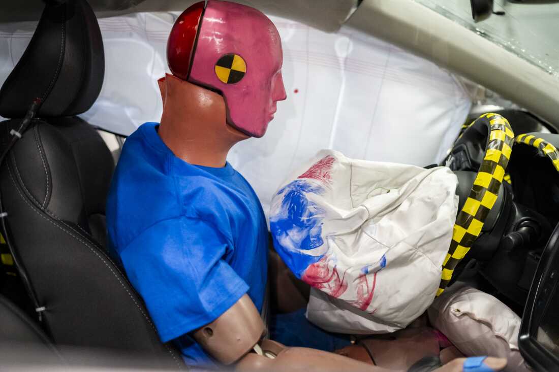 Interior deformation and safety-system deployment are visible inside a car following an IIHS crash test in Ruckersville, Va., on Tuesday, Dec. 2, 2025. Photographer: Carlos Bernate for NPR.