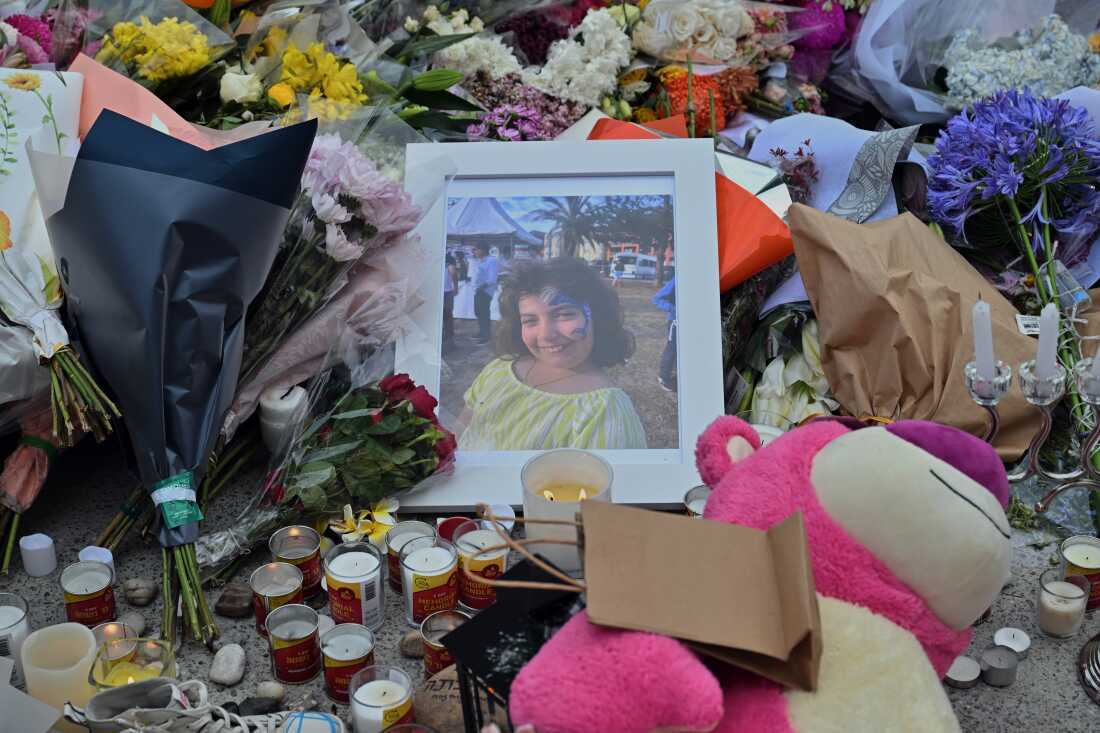 A photo of shooting victim Matilda, a 10-year-old whose last name has been withheld at the request of her family, is placed amongst flowers at a memorial made at the Bondi Pavilion in Sydney, Dec. 17, 2025, following Sunday's shooting.