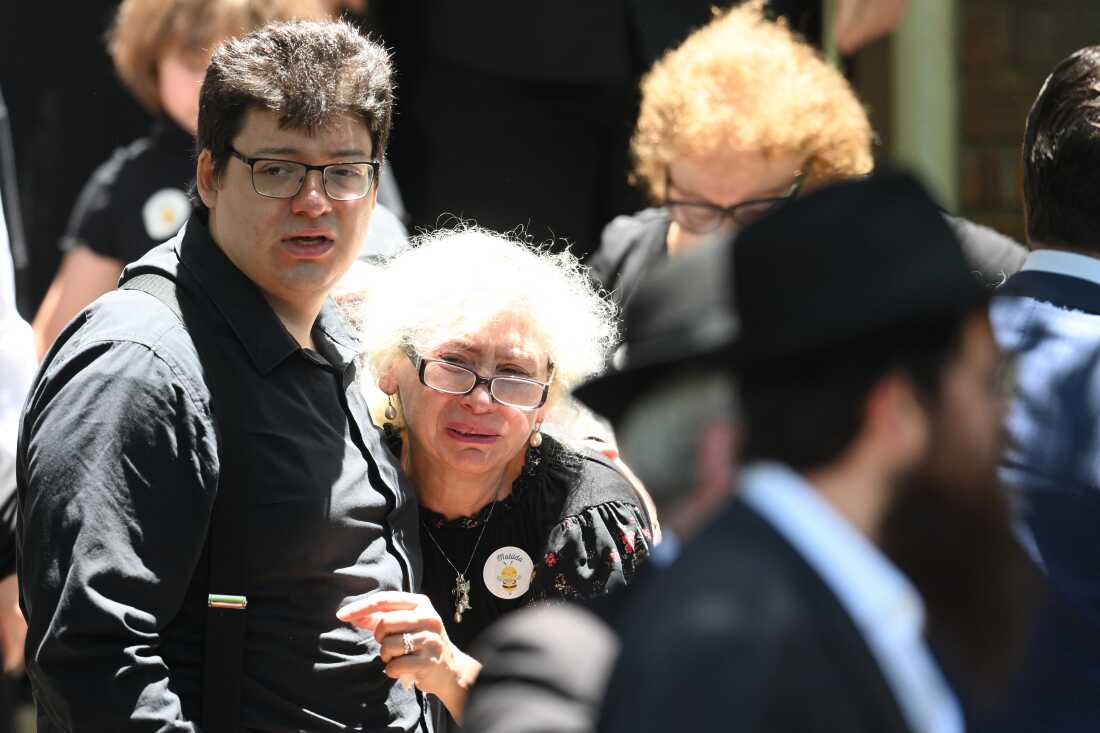 Mourners react at the funeral of Bondi Beach mass shooting victim 10-year-old Matilda, whose last name is being withheld at the request of her family, in Sydney, Thursday, Dec. 18, 2025.