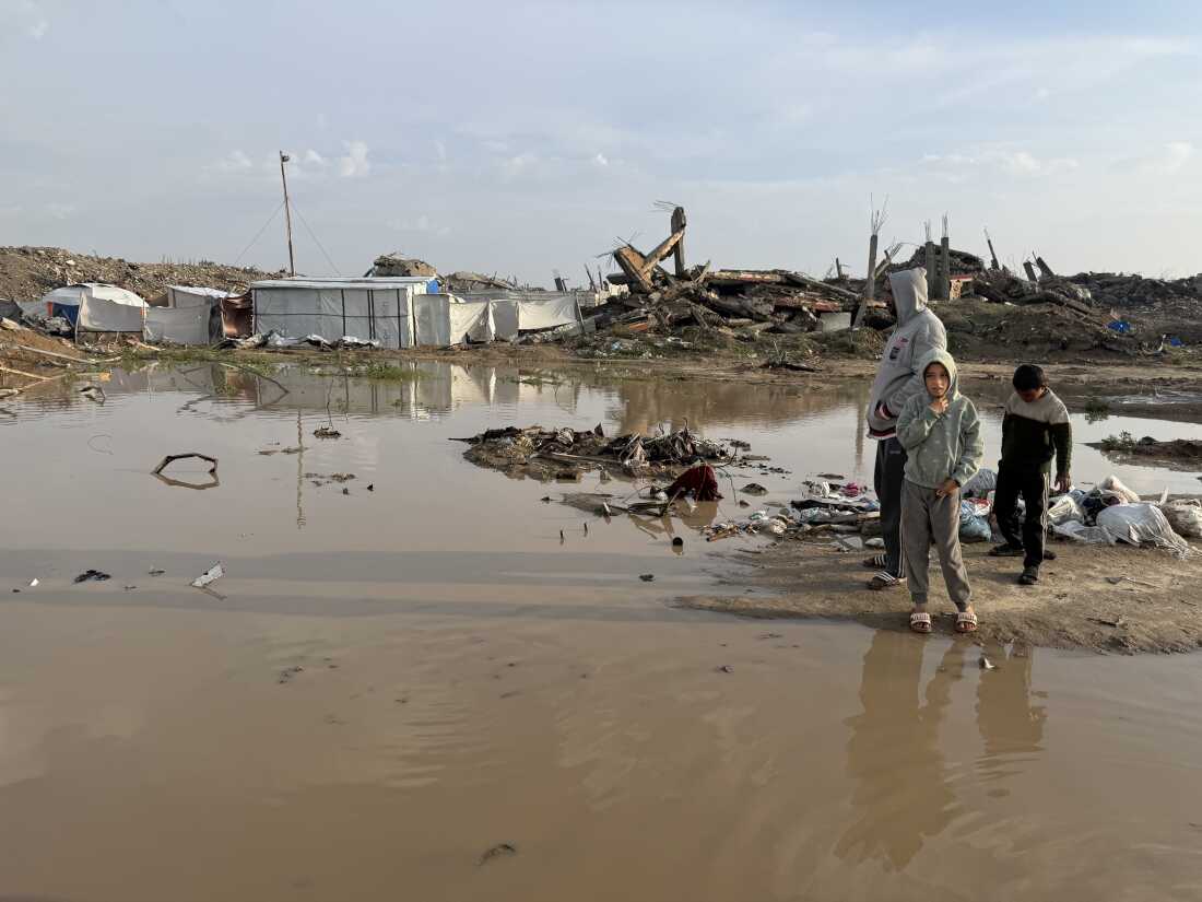 Dirty water pools near the tents of displaced families after a storm made landfall in Gaza City, flooding tents and destroying thousands of makeshift shelters on Dec. 11.