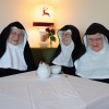 The three nuns, Sister Rita (82, l-r), Sister Regina (86) and Sister Bernadette (88), sit during an interview in a guesthouse