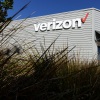 The Verizon logo is displayed on the exterior of a Verizon store. The FCC approved its $20 billion deal to buy Frontier Communications, a day after Verizon told the U.S. regulator that it would end many of its diversity-related policies. 