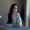 Ukrainian refugee Iryna Koshun, 38, poses for a portrait at her apartment in Edina, MN, March 8, 2025. Koshun and her two children were sponsored to the US through the Uniting for Ukraine temporary parole program, while Koshun’s husband is fighting on the frontlines in the Ukrainian military.