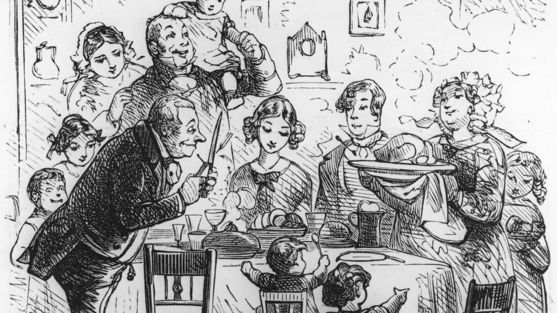 A family at their Victorian-era Christmas dinner, circa 1840.