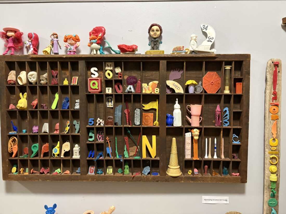 Pez containers, golf tees, the remains of printer’s blocks and a sand timer are among the items collected from the beach and displayed at the Plum Island Museum of Lost Toys & Curiosities.