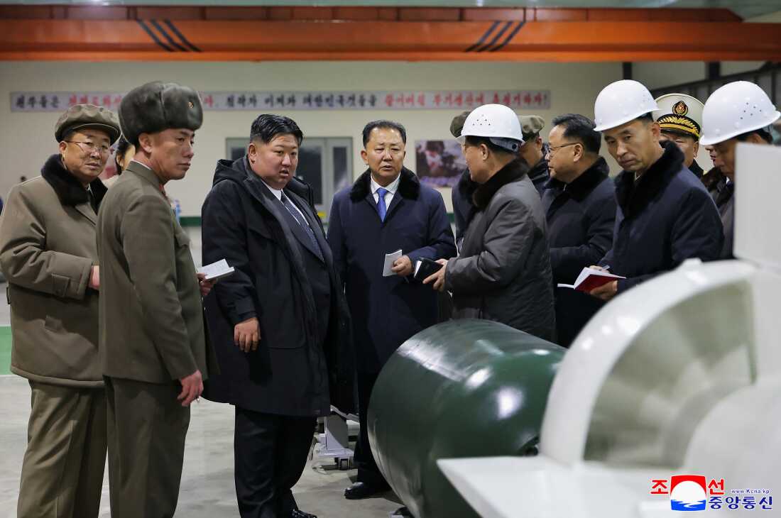 In this undated photo provided Thursday, Dec. 25, 2025, by the North Korean government, its leader Kim Jong Un, third left, visits a shipyard as he inspects a nuclear-powered submarine under construction at an undisclosed location in North Korea. Independent journalists were not given access to cover the event depicted in this image distributed by the North Korean government. The content of this image is as provided and cannot be independently verified. Korean language watermark on image as provided by source reads: "KCNA" which is the abbreviation for Korean Central News Agency. (Korean Central News Agency/Korea News Service via AP)