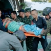 In this photo released by Royal Thai Army, a wounded Thai soldier is carried to be transferred to a hospital in Sisaket province, Thailand, Sunday, Dec. 7, 2025, after, according to a Thai army spokesperson, Cambodian troops fired into Thai territory.