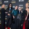 From left, Shannon Tweed Simmons, 2025 Kennedy Center Honoree and member of rock band KISS Gene Simmons, Gigi Criss, 2025 Kennedy Center Honoree and member of rock band KISS Peter Criss, Erin Stanley and 2025 Kennedy Center Honoree and member of rock band KISS Paul Stanley pose on the red carpet for the 48th Kennedy Center Honors at the Kennedy Center for the Performing Arts.