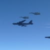 This photo provided by Japan's Ministry of Defense shows the Japan Air Self-Defense Force's F-15 fighters holding a joint military drill with U.S. B-52 bombers in the vicinity of Japanese airspace on Wednesday.