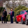 President Trump, accompanied by Tesla CEO Elon Musk and his son X Æ A-Xii, speaks next to a line of Tesla vehicles on the South Lawn of the White House on Tuesday. Trump said he would purchase a Tesla vehicle in what he calls a "show of confidence and support" for Musk. But while Musk is very popular among Republicans, Democrats remain more interested in purchasing electric vehicles.