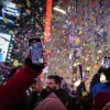 Revelers celebrate after the ball drops in New York's Times Square, Wednesday, Jan. 1, 2025, in New York.